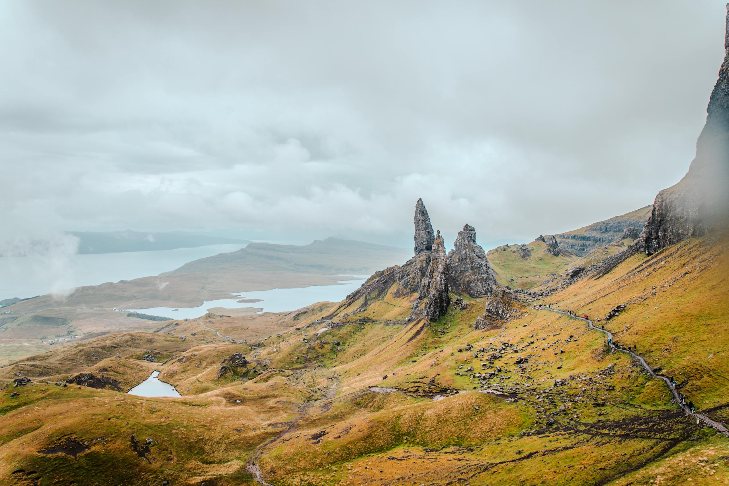 A breathtaking aerial shot of the iconic Old Man of Storr rock formation on the Isle of Skye, Scotland.