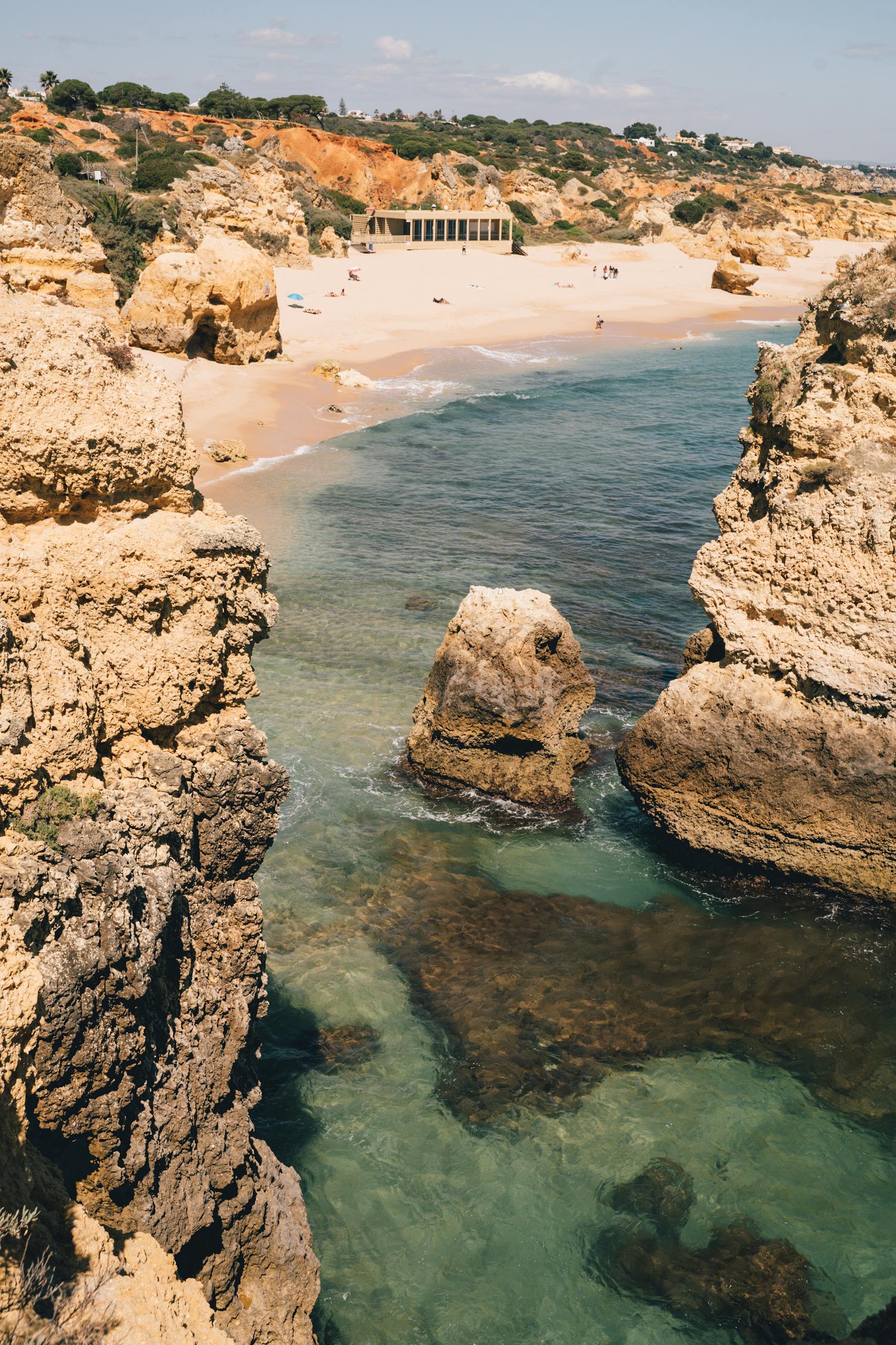 Discover the stunning cliffs and blue waters along Portugal's Algarve coast during summer.