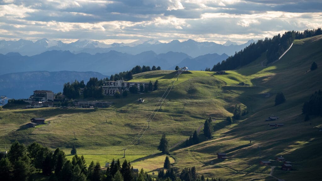 Ski resort hillside with chairlift and hotel, Dolomites, Italy