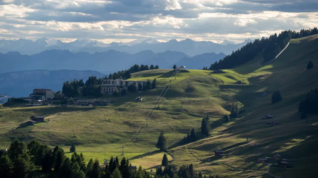 Ski resort hillside with chairlift and hotel, Dolomites, Italy