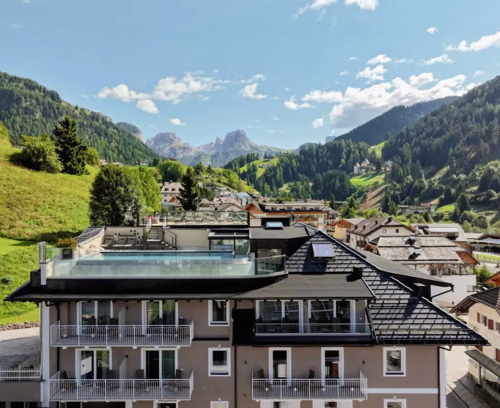 Panoramic rooftop pool at Hotel Touring with Dolomites views, Santa Cristina, Val Gardena