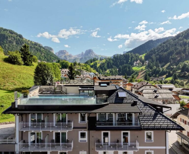 Panoramic rooftop pool at Hotel Touring with Dolomites views, Santa Cristina, Val Gardena
