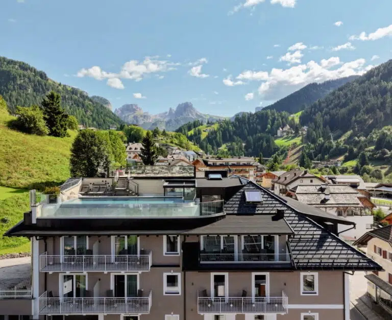 Panoramic rooftop pool at Hotel Touring with Dolomites views, Santa Cristina, Val Gardena