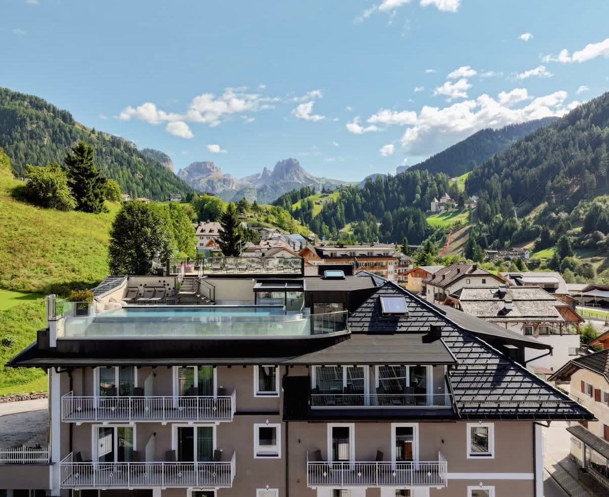 Panoramic rooftop pool at Hotel Touring with Dolomites views, Santa Cristina, Val Gardena