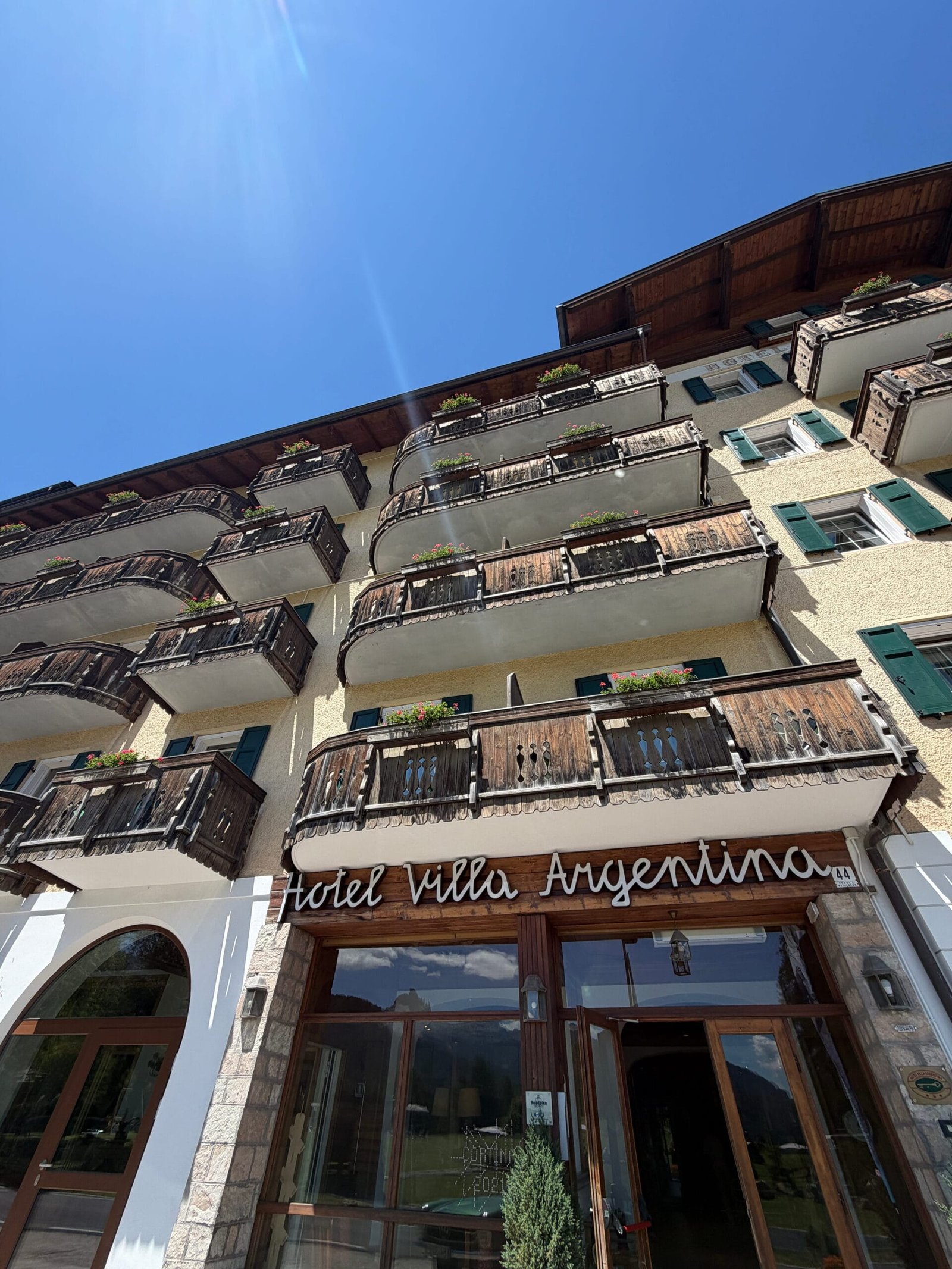Hotel Villa Argentina entrance and balconies in Pocol, Cortina d'Ampezzo, Dolomites