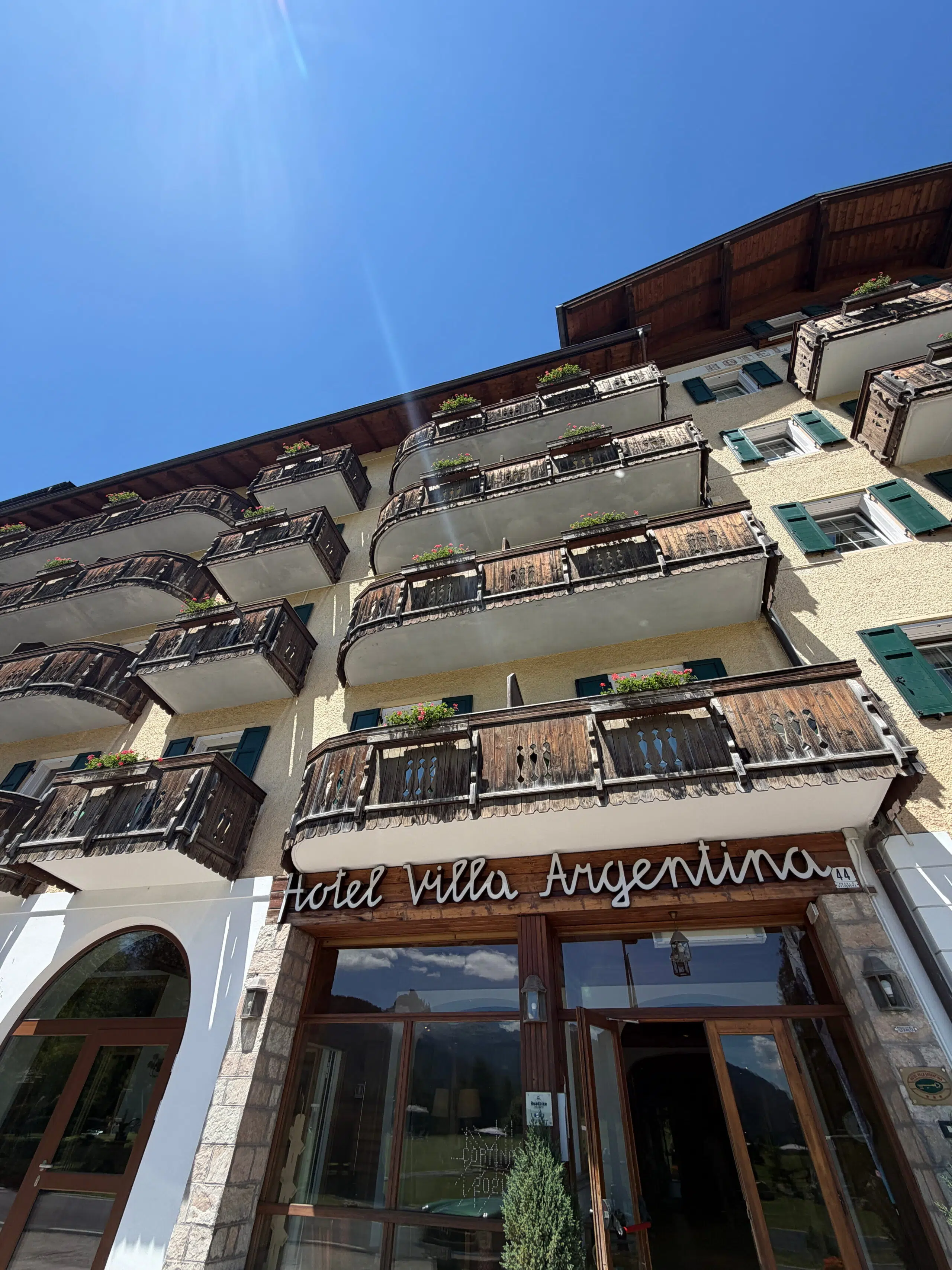 Hotel Villa Argentina entrance and balconies in Pocol, Cortina d'Ampezzo, Dolomites