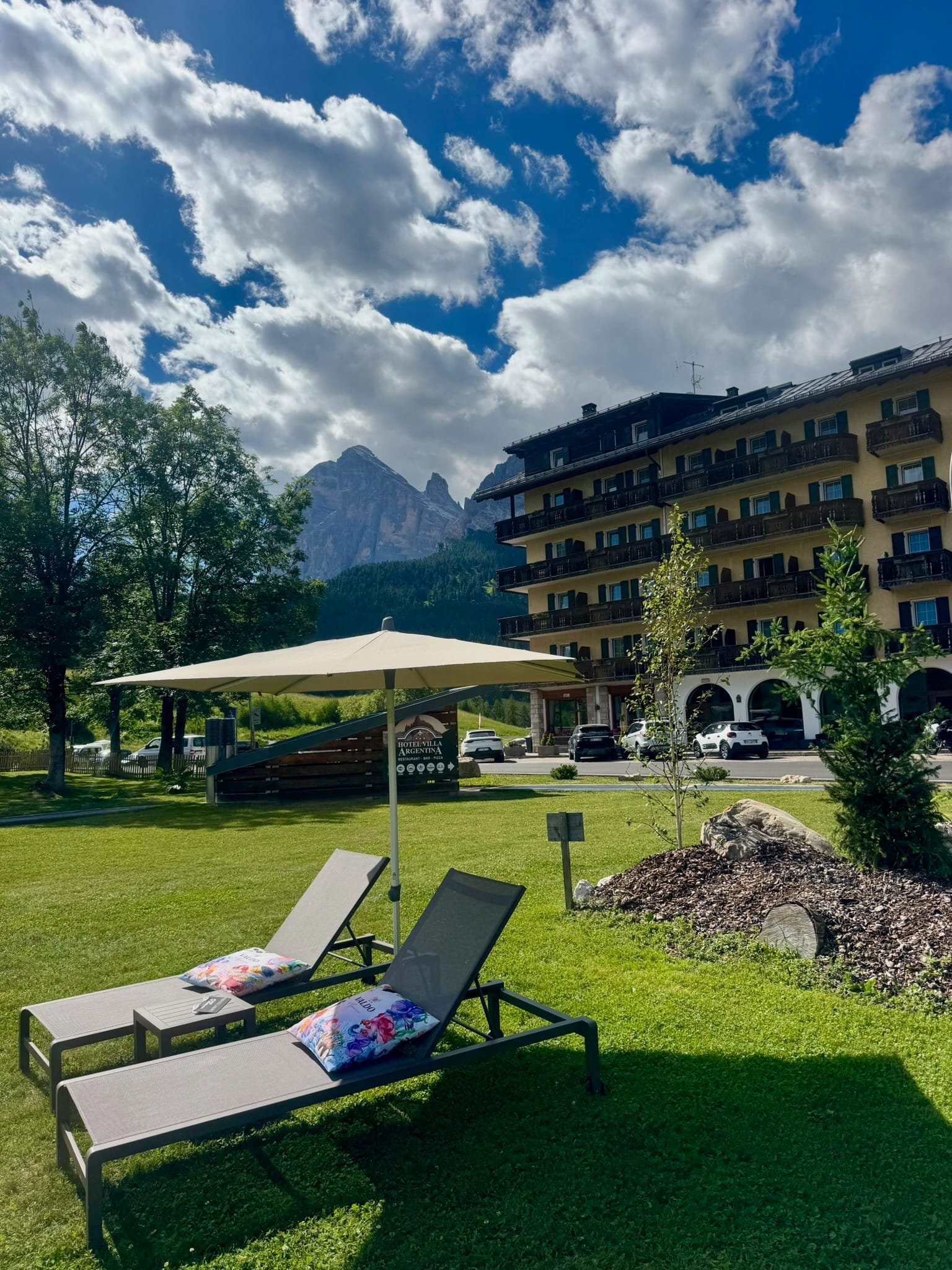 View of the Dolomites from the lawn at Hotel Villa Argentina in Pocol, Cortina d'Ampezzo