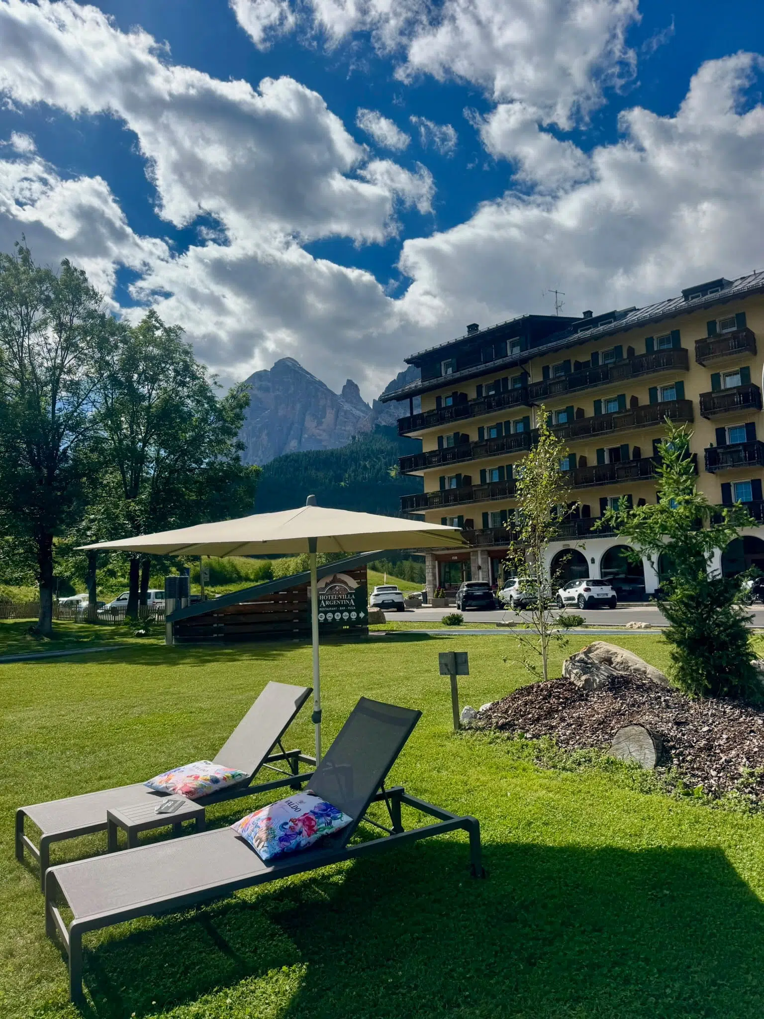 View of the Dolomites from the lawn at Hotel Villa Argentina in Pocol, Cortina d'Ampezzo