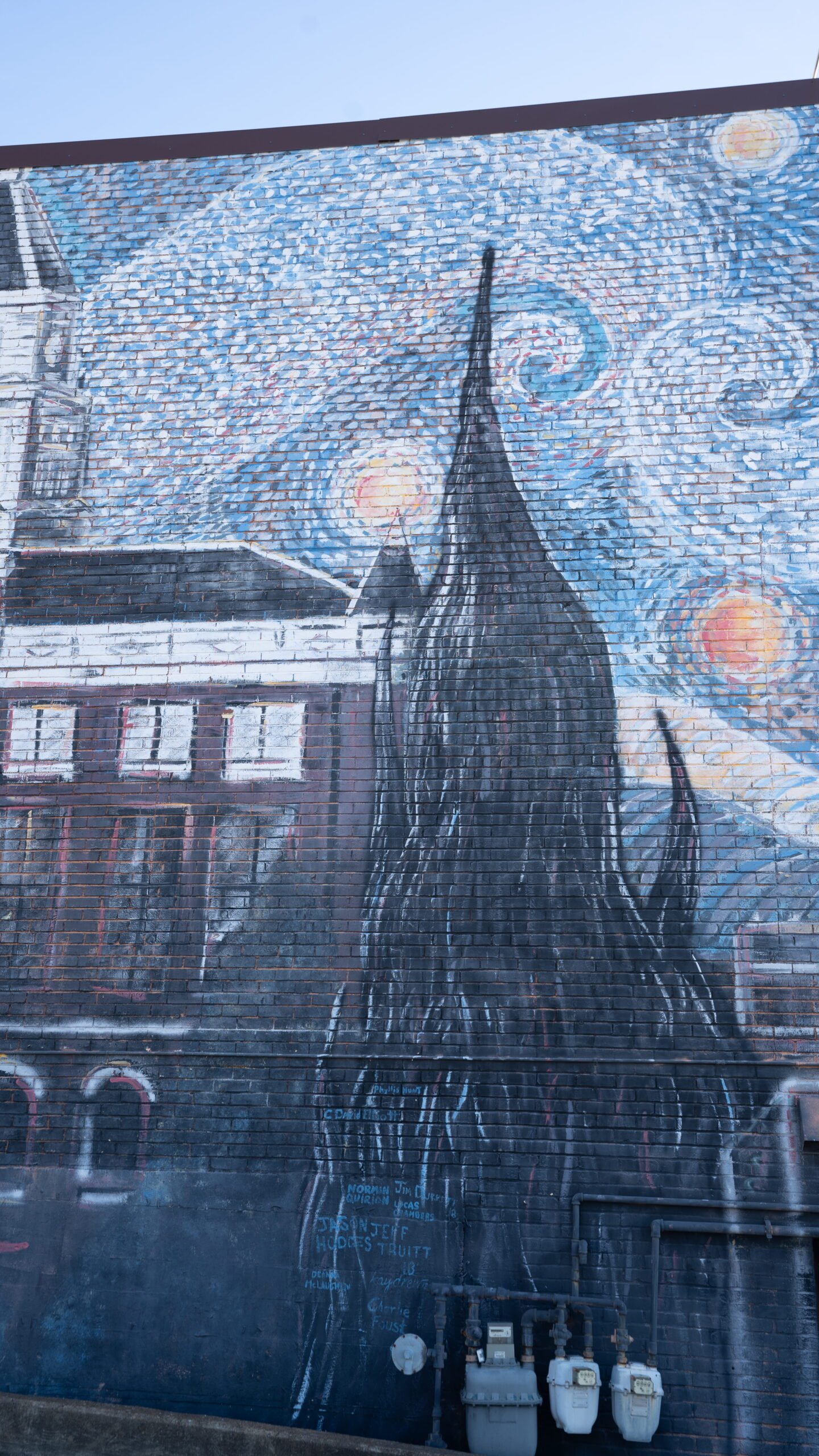 Close-up of the swirling sky and church steeple on the Starry Night mural in downtown Clarksville, TN