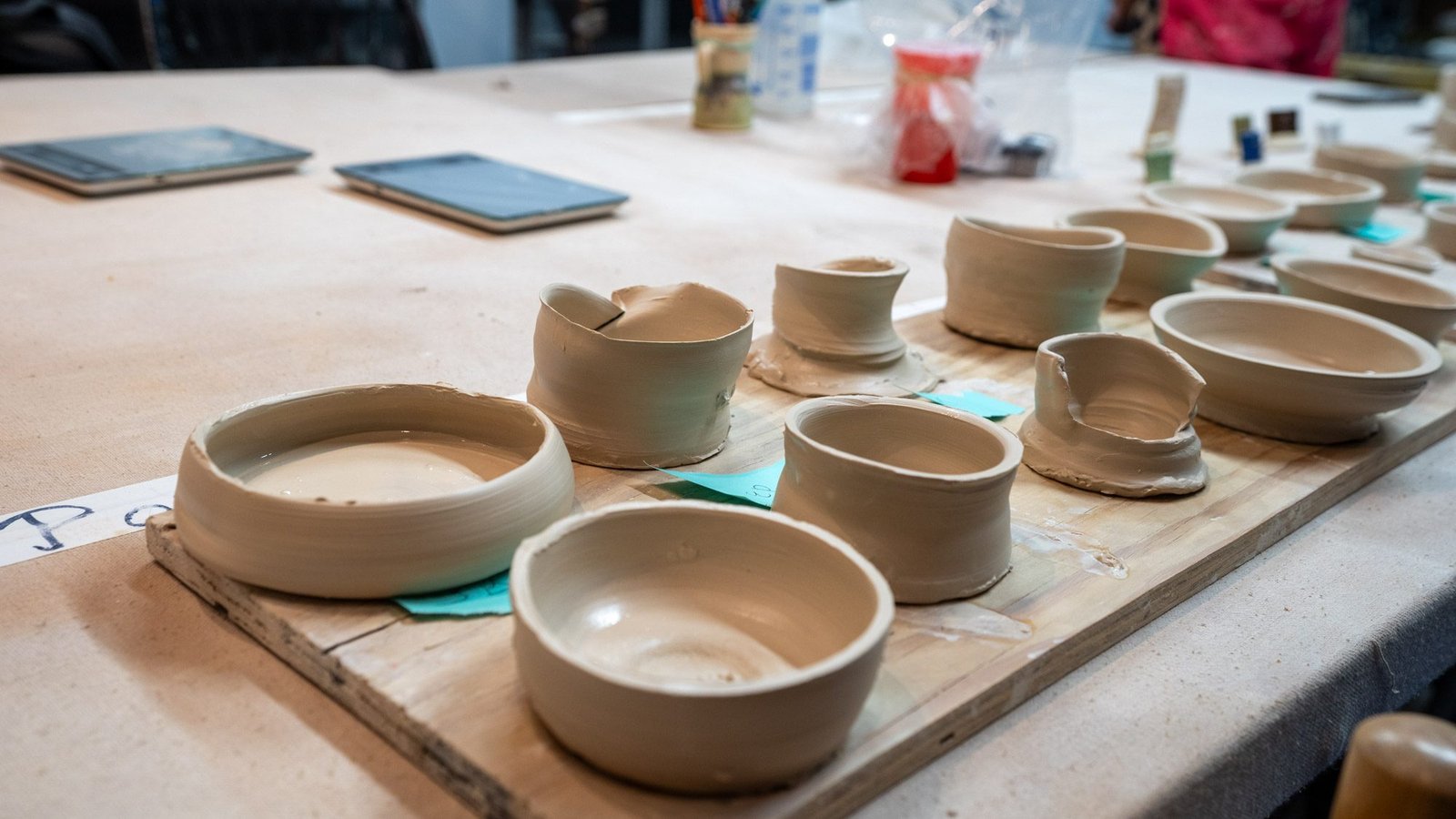 Freshly thrown clay bowls drying after a pottery wheel class at River City Clay in Clarksville