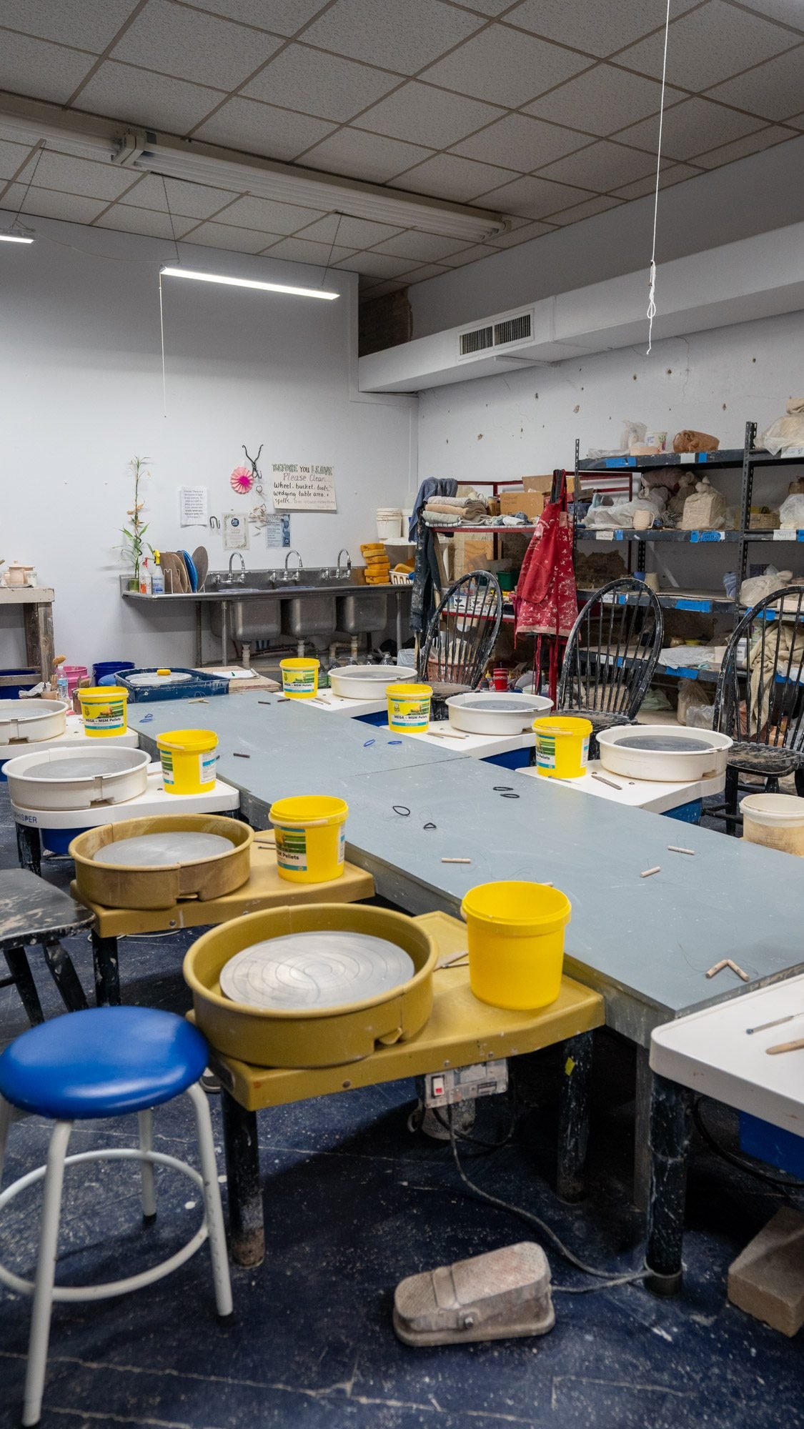 Rows of pottery wheels inside the River City Clay studio in Clarksville, TN