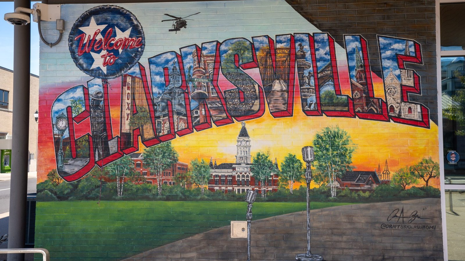 Colorful Welcome to Clarksville postcard-style mural in downtown Clarksville, Tennessee